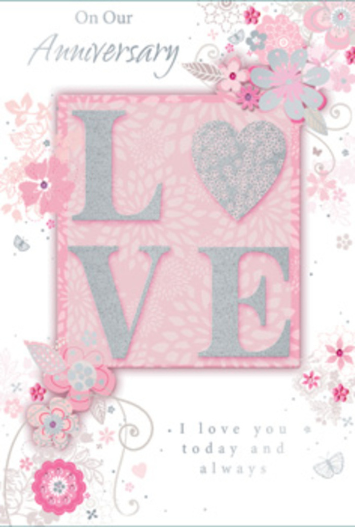 The anniversary card in this image captures the gentle romance of Blackheath at dusk, its design unfolding like a softly scented arrangement laid out on pale card. Dominating the centre, the word LOVE appears in large, rounded letters that rise slightly from the surface. Each letter is coated in a fine layer of glitter, catching the light in tones of silver and pearl, so the word seems to glow against a blush-pink rectangle that anchors the entire design. Around this focal point, an intricate network of stylized blooms, wispy leaves, and slender curling stems drifts across the card in a loose, swirling pattern. The flowers are rendered in a palette of powder pinks, pearly whites, and soft greys, with occasional silver highlights that echo the glittered lettering. These shapes call to mind the first sketches made by an experienced florist, visualising how roses, daisies, and fillers might sit together in a romantic hand-tied bunch ready for delivery around Blackheath Village. The background remains a smooth, soft pink, unbroken by harsh lines, which allows the floral drawings and raised letters to stand out with quiet clarity. Light appears to fall gently from one side, creating faint shadows that emphasise the texture of the glitter and the slight embossing of the design. Above and below the floral motif, an anniversary greeting written in flowing script expresses lasting devotion and shared memories, the letters slender yet distinct, like handwriting practiced over many years of sending cards and bouquet notes. The overall impression is of calm, enduring love: a delicate balance of pastel hues, tactile surfaces, and graceful curves, evoking the peaceful rhythm of life and love around Blackheath and its open heathland.