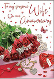 This image of an anniversary card captures a moment of thoughtful romance that feels right at home in Blackheath, as if it were arranged on a bedside table after a surprise delivery from Blackheath Flowers. At the centre of the composition, a compact cluster of crimson roses seems almost three-dimensional, the petals layered in rich spirals that move from deep, velvety red at the heart to slightly lighter tones at the edges. Nestled around the blooms are plush ferns and soft greenery, adding contrast and a hint of woodland freshness reminiscent of walks across the Heath on a cool evening. Gentle, diffused light washes over the scene, bringing out the natural sheen of the petals and softening the shadows so that every detail feels inviting and tender. Close to the roses sits a scarlet jewellery box, tied neatly with ribbon, its colour matching the flowers and reinforcing the sense of a well-planned anniversary surprise. A golden necklace crafted in the shape of intertwined hearts lies just in front, its smooth metal catching delicate glints that suggest candlelight or low lamps in a Blackheath townhouse. Scattered around are twinkling decorations and tiny red hearts that add sparkle and movement, while butterfly and heart motifs float around the scripted text, which is penned in a flowing, elegant style. The palette of rich reds, warm golds, soft creams, and fresh greens creates an atmosphere of intimacy and celebration, perfectly suited to honouring a couple's shared history and future plans in the heart of Blackheath.